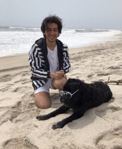 Jacob photographed with his dog in the Hamptons